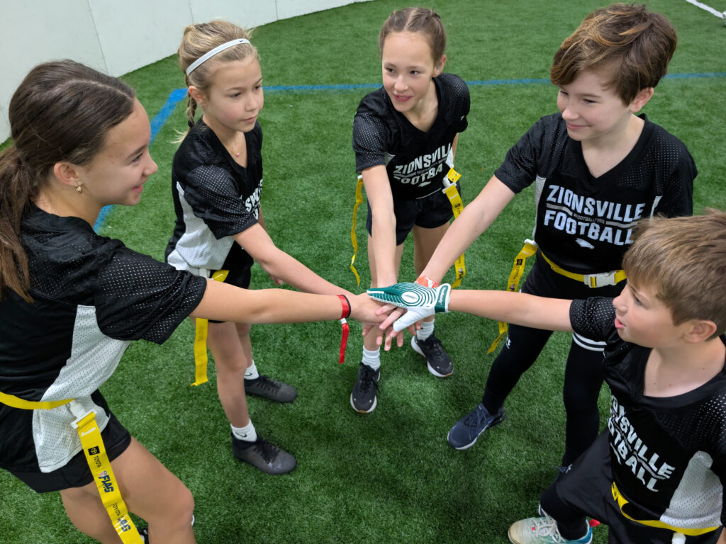Girls Flag Football Hands In Breakdown Zionsville